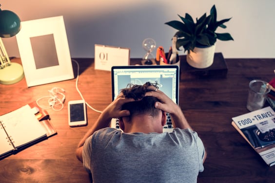 man-stressed-while-working-on-laptop-2026-01-07-23-25-06-utc